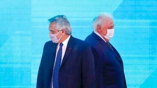 Argentine President Alberto Fernandez, left, walks past Health Minister Gines Gonzalez Garcia as they arrive to a law signing ceremony, in Buenos Aires, Argentina.(AP/ File photo)