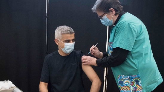 Mayor of London Sadiq Khan receives his first dose of the Pfizer coronavirus vaccine administered by Dr. Sue Clarke at a COVID-19 vaccination clinic at the Mitcham Lane Baptist Church in south London, Friday Feb. 19, 2021. (Stefan Rousseau/PA via AP)(AP) Mayor of London Sadiq Khan receives his first dose of the Pfizer coronavirus vaccine administered by Dr. Sue Clarke at a COVID-19 vaccination clinic at the Mitcham Lane Baptist Church in south London, Friday Feb. 19, 2021. (Stefan Rousseau/PA via AP)(AP)