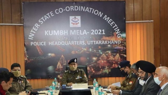DGP Ashok Kumar (centre) chairing the inter-state coordination meeting for Mahakumbh on Friday evening. (HT Photo) DGP Ashok Kumar (centre) chairing the inter-state coordination meeting for Mahakumbh on Friday evening. (HT Photo)