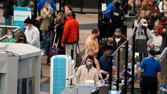 Travelers wear face coverings as they queue up at the north security checkpoint in the main terminal of Denver International Airport, in Denver. (AP File Photo) Travelers wear face coverings as they queue up at the north security checkpoint in the main terminal of Denver International Airport, in Denver. (AP File Photo)
