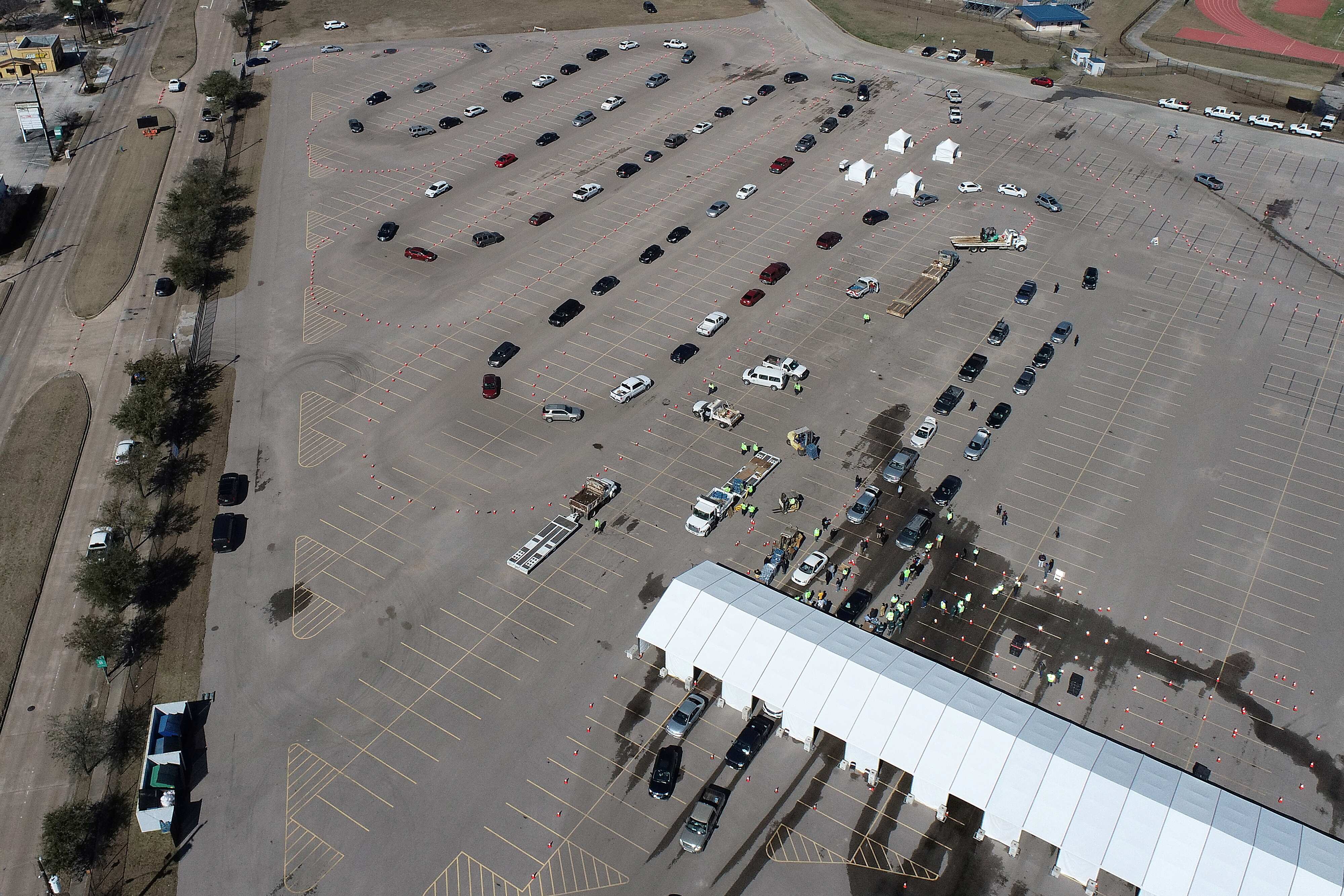 Cars line up to receive free cases of water after the city of Houston implemented a boil water advisory following an unprecedented winter storm, in an aerial photograph taken at Delmar Stadium in Houston, Texas, U.S. (REUTERS)
