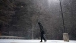 FILE - In this Feb. 14, 2021, file photo, woman walks through falling snow in San Antonio. As temperatures plunged and snow and ice whipped the state, much of Texas' power grid collapsed, followed by its water systems. (AP) FILE - In this Feb. 14, 2021, file photo, woman walks through falling snow in San Antonio. As temperatures plunged and snow and ice whipped the state, much of Texas' power grid collapsed, followed by its water systems. (AP)