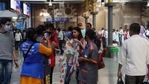 A municipal worker clicks a photo of commuters not wearing face masks and thereby violating Covid-19 norms at Chhatrapati Shivaji Maharaj Terminus in Mumbai.(AP) A municipal worker clicks a photo of commuters not wearing face masks and thereby violating Covid-19 norms at Chhatrapati Shivaji Maharaj Terminus in Mumbai.(AP)