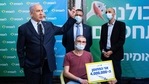 Israeli Health Minister Yuli Edelstein, left, visit the Leumit Health Care Services vaccination facility in Jerusalem, Tuesday, Feb. 16, 2021. (AP) Israeli Health Minister Yuli Edelstein, left, visit the Leumit Health Care Services vaccination facility in Jerusalem, Tuesday, Feb. 16, 2021. (AP)