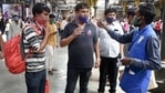 A BMC official collects fine from commuters for not wearing face masks, at CSMT, in Mumbai on Saturday.(PTI Photo) A BMC official collects fine from commuters for not wearing face masks, at CSMT, in Mumbai on Saturday.(PTI Photo)