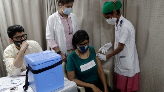 A health worker administers a Covid-19 vaccine to a frontline worker in Mumbai. .(AP Photo)