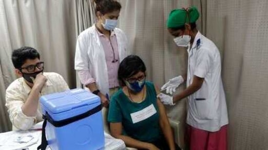 A healthcare worker administers Covid-19 vaccine to a frontline worker in Mumbai, on Saturday.(AP Photo) A healthcare worker administers Covid-19 vaccine to a frontline worker in Mumbai, on Saturday.(AP Photo)