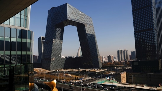 Cars travel past the CCTV headquarters, the home of Chinese state media outlet CCTV and its English-language sister channel CGTN, in Beijing.(REUTERS)