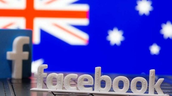 A 3D printed Facebook logo is seen in front of displayed Australia's flag. (Reuters)