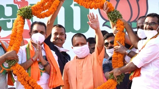 Uttar Pradesh CM Yogi Adityanath being garlanded during the BJP's Vijaya Yatra from Kasaragod on Sunday. (ANI Photo)