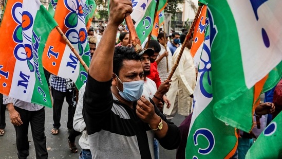 A supporter of Trinamool Congress party adjusts his face mask as he walks in a rally protesting fuel and cooking gas price hike in Kolkata, India, Saturday, Feb. 20, 2021. (AP Photo/Bikas Das) (AP) A supporter of Trinamool Congress party adjusts his face mask as he walks in a rally protesting fuel and cooking gas price hike in Kolkata, India, Saturday, Feb. 20, 2021. (AP Photo/Bikas Das) (AP)
