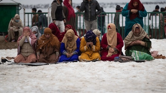Devotees offer special prayers on plastic sheets on a snow-covered ground in Srinagar, Indian controlled Kashmir.(AP/ Representative image)