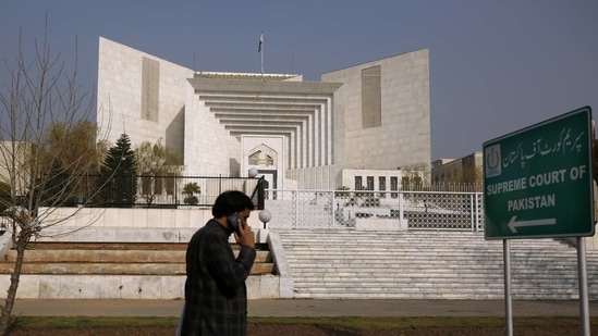 A man walks past the Supreme Court building in Islamabad, Pakistan(AP Photo)