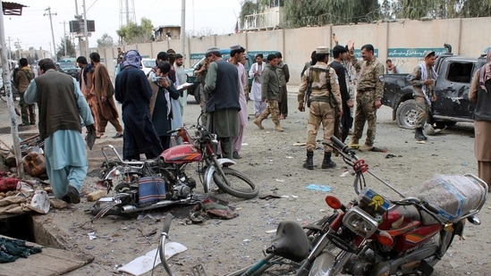 Helmand: Security personnel inspect the site of a deadly roadside bomb explosion in Helmand province, southern Afghanistan, Sunday, Feb. 21, 2021. Two separate roadside bomb explosions in Afghanistan on Sunday killed and wounded numerous people. AP/PTI(AP02_21_2021_000191A)(AP) Helmand: Security personnel inspect the site of a deadly roadside bomb explosion in Helmand province, southern Afghanistan, Sunday, Feb. 21, 2021. Two separate roadside bomb explosions in Afghanistan on Sunday killed and wounded numerous people. AP/PTI(AP02_21_2021_000191A)(AP)