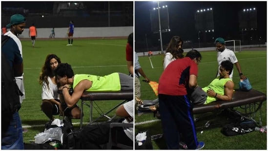 Disha Patani is seen next to Tiger Shroff as he got checked on after hurting his leg on the football field.