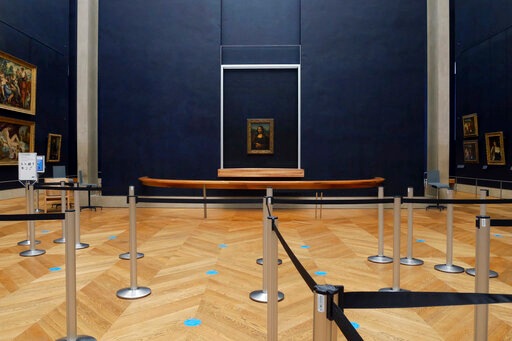 Leonardo da Vincis Mona Lisa hangs on the wall in a deserted Louvre museum, in Paris.(AP) Leonardo da Vincis Mona Lisa hangs on the wall in a deserted Louvre museum, in Paris.(AP)
