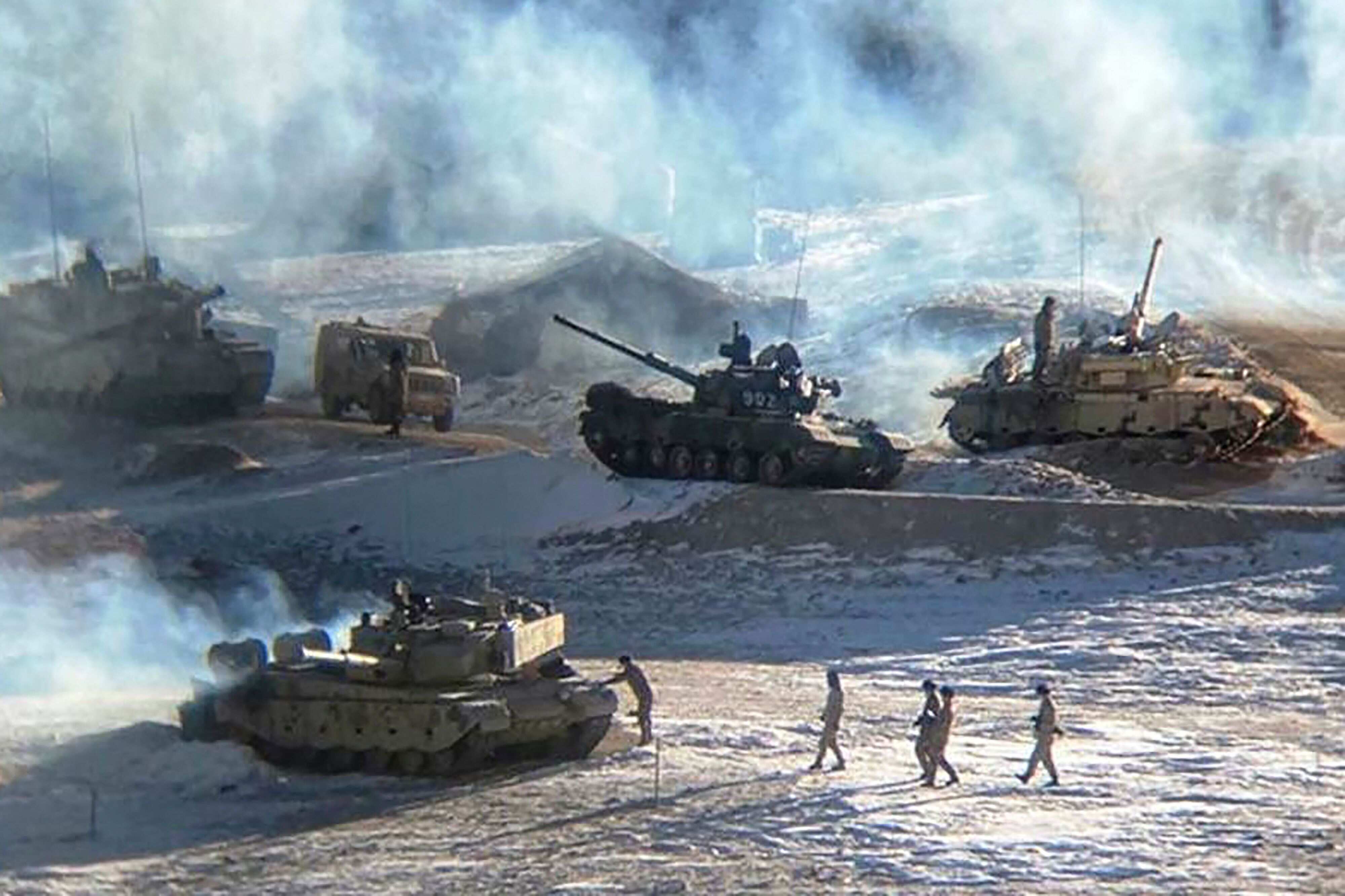 This undated handout photograph released by the Indian Army on February 16, 2021, shows People's Liberation Army (PLA) soldiers and tanks during military disengagement along the Line of Actual Control (LAC) at the India-China border in Ladakh. (Photo by MINISTRY OF DEFENCE) This undated handout photograph released by the Indian Army on February 16, 2021, shows People's Liberation Army (PLA) soldiers and tanks during military disengagement along the Line of Actual Control (LAC) at the India-China border in Ladakh. (Photo by MINISTRY OF DEFENCE)