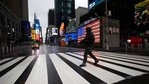 A man crosses the street in a nearly empty Times Square, which is usually very crowded on a weekday morning in New York, March 23, 2020. (AP Photo/Mark Lennihan)(AP) A man crosses the street in a nearly empty Times Square, which is usually very crowded on a weekday morning in New York, March 23, 2020. (AP Photo/Mark Lennihan)(AP)