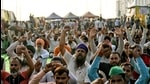 Farmers shouting slogans at the demonstration site during the ongoing farmer protest against the new farm laws at Ghazipur Border, in New Delhi on Sunday. (ANI) Farmers shouting slogans at the demonstration site during the ongoing farmer protest against the new farm laws at Ghazipur Border, in New Delhi on Sunday. (ANI)
