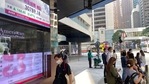 People walk past a bank's electronic board showing the Hong Kong share index in Hong Kong Monday, Feb. 22, 2021. (AP) People walk past a bank's electronic board showing the Hong Kong share index in Hong Kong Monday, Feb. 22, 2021. (AP)