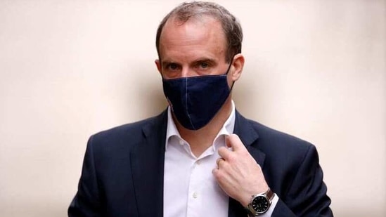 Britain's Foreign Affairs Secretary Dominic Raab walks outside Downing Street in London, Britain,(Reuters)