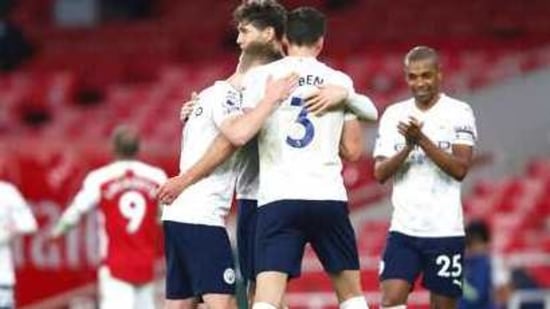 Manchester City players celebrate at the end of the English Premier League soccer match between Arsenal and Manchester City at the Emirates stadium in London.(AP)