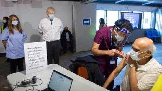 Britain's Prime Minister Boris Johnson watches a patient receiving a dose of the Oxford AstraZeneca Covid-19 vaccine. (AP File Photo ) Britain's Prime Minister Boris Johnson watches a patient receiving a dose of the Oxford AstraZeneca Covid-19 vaccine. (AP File Photo )