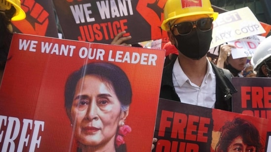 Protesters hold signs calling for the release of detained Myanmar civilian leader Aung San Suu Kyi during a demonstration against the military coup in Yangon on February 21, 2021. Protesters hold signs calling for the release of detained Myanmar civilian leader Aung San Suu Kyi during a demonstration against the military coup in Yangon on February 21, 2021.