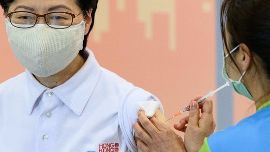 Hong Kong's Chief Executive Carrie Lam receives China's Sinovac COVID-19 coronavirus vaccine at the Community Vaccination Centre in Hong Kong on February 22, 2021. (Photo by Anthony WALLACE / AFP) (AFP)