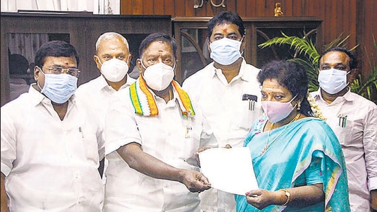 Puducherry Chief Minister V Narayanasamy hands over his resignation letter to Lt Governor Dr Tamilisai Soundararajan after he failed to prove his majority in the assembly, in Puducherry, Feb. 22. (PTI) Puducherry Chief Minister V Narayanasamy hands over his resignation letter to Lt Governor Dr Tamilisai Soundararajan after he failed to prove his majority in the assembly, in Puducherry, Feb. 22. (PTI)