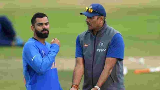 India captain Virat Kohli chats with coach Ravi Shastri during Cricket World Cup on July 05, 2019 in Leeds, England.(Getty Images)