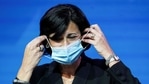 Dr Rochelle Walensky, now director of the US CDC, removes her mask to speak as Joe Biden announces nominees and appointees.(REUTERS)