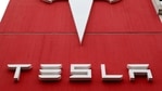 FILE PHOTO: FILE PHOTO: The logo of car manufacturer Tesla is seen at a branch office in Bern, Switzerland October 28, 2020. REUTERS/Arnd Wiegmann/File Photo/File Photo(REUTERS)