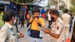 BMC officials penalise a commuter for not wearing masks, amid rise in coronavirus cases across Maharashtra, in Mumbai. (PTI Photo)