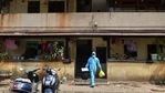 A health worker leaves a residential area after conducting swab tests for Covid-19.(PTI) A health worker leaves a residential area after conducting swab tests for Covid-19.(PTI)
