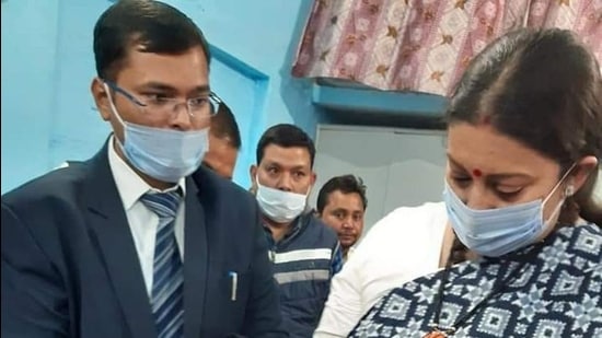 Union minister Smriti Irani with papers for land registration in Amethi on Monday. (HT photo) Union minister Smriti Irani with papers for land registration in Amethi on Monday. (HT photo)