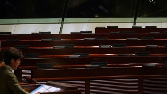 FILE PHOTO: Empty seats of pro-democracy lawmakers are seen during Hong Kong Chief Executive Carrie Lam's annual policy address at the Legislative Council in Hong Kong, China November 25, 2020. REUTERS/Lam Yik/File Photo(REUTERS)