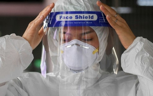 A health worker gets ready to collect samples during proactive testing of migrant workers at their work place, amid the spread of the coronavirus disease (COVID-19) outbreak in Samut Sakhon province in Thailand. (REUTERS) A health worker gets ready to collect samples during proactive testing of migrant workers at their work place, amid the spread of the coronavirus disease (COVID-19) outbreak in Samut Sakhon province in Thailand. (REUTERS)