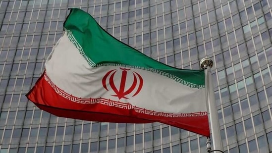 An Iranian flag flutters in front of the International Atomic Energy Agency (IAEA) headquarters in Vienna, Austria.(Reuters File)