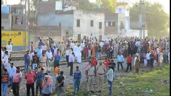 People gather near the site of a train accident at Joda Phatak in Amritsar on Saturday, a day after a train mowed down scores of people watching the Dussehra celebrations (AFP file) People gather near the site of a train accident at Joda Phatak in Amritsar on Saturday, a day after a train mowed down scores of people watching the Dussehra celebrations (AFP file)
