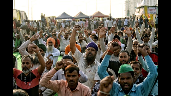 Farmers shouting slogans at the demonstration site during the ongoing protest against the new farm laws, Ghazipur , February 20 (ANI)