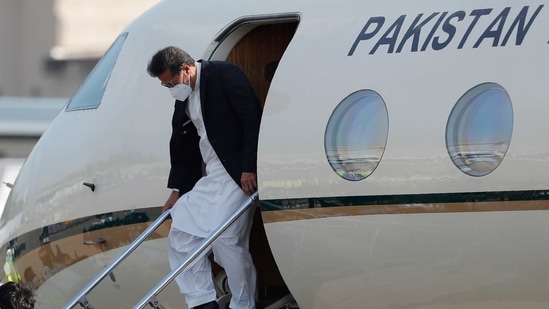 Pakistan Prime Minister Imran Khan disembarks from an aircraft after his arrival in Colombo on Tuesday on a two day visit. (AP)