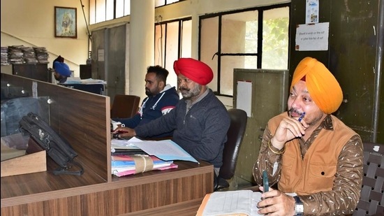 Staff of district education office elementary without masks in Ludhiana on Monday. (Harsimar Pal Singh/HT)