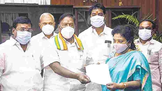 Puducherry Chief Minister V Narayanasamy hands over his resignation letter to Lt Governor Dr Tamilisai Soundararajan after he failed to prove his majority in the assembly, in Puducherry, Feb. 22. (PTI) Puducherry Chief Minister V Narayanasamy hands over his resignation letter to Lt Governor Dr Tamilisai Soundararajan after he failed to prove his majority in the assembly, in Puducherry, Feb. 22. (PTI)