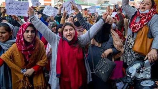 Wives of Kashmir’s former militants who had returned from Pakistan and Pakistan-occupied Kashmir in response to a rehabilitation programme in 2010 shout slogans during a protest in Srinagar on Tuesday, (AP) Wives of Kashmir’s former militants who had returned from Pakistan and Pakistan-occupied Kashmir in response to a rehabilitation programme in 2010 shout slogans during a protest in Srinagar on Tuesday, (AP)