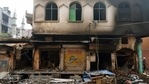 A view of shops that were burnt outside the Maula Baksh Masjid in Ashok Nagar, New Delhi, India, on Wednesday, February 26, 2020.