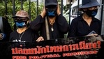 Protesters display a banner outside the Criminal Court in Bangkok on February 24, 2021, during a demonstration calling for the release of pro-democracy activists held under Thailand's lese-majeste royal defamation laws. (Photo by Jack TAYLOR / AFP)(AFP) Protesters display a banner outside the Criminal Court in Bangkok on February 24, 2021, during a demonstration calling for the release of pro-democracy activists held under Thailand's lese-majeste royal defamation laws. (Photo by Jack TAYLOR / AFP)(AFP)