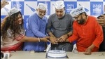 Aam Aadmi Party (AAP) candidate Gulabsinh Yadav along with supporters cuts a cake at an event after emerging victorious during Gujarat Municipal Corporation polls, in Ahmedabad, Tuesday. (PTI) Aam Aadmi Party (AAP) candidate Gulabsinh Yadav along with supporters cuts a cake at an event after emerging victorious during Gujarat Municipal Corporation polls, in Ahmedabad, Tuesday. (PTI)