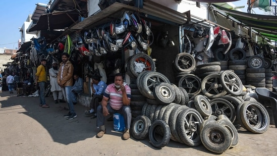 A year later, the tyre market in Gokulpuri, New Delhi. “Many shopkeepers here lost all their businesses built over years and decades. We now have to work seven days a week and longer hours to even attempt a recovery,” said the market’s vice president, Mohammad Rashid.(Amal KS / HT Photo)