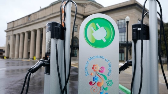 An electric car charging station is positioned outside the Science Museum. (AP File Photo ) An electric car charging station is positioned outside the Science Museum. (AP File Photo )